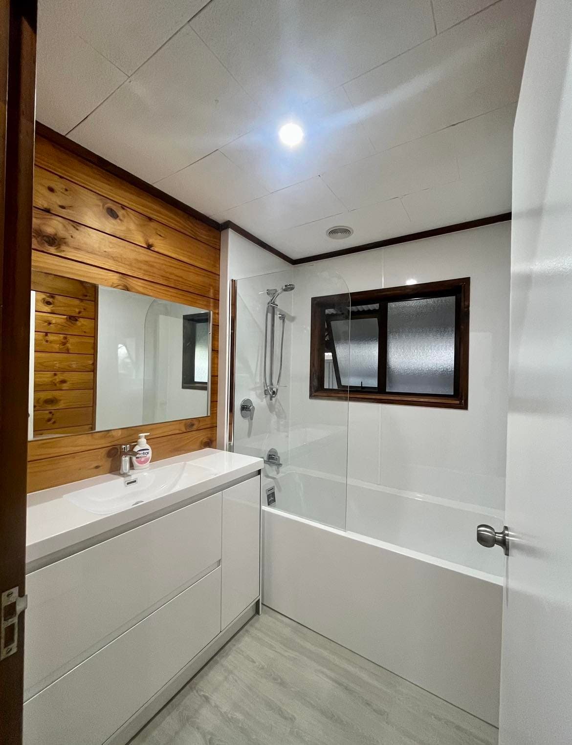 An added ensuite — extension matched to the existing home's character.