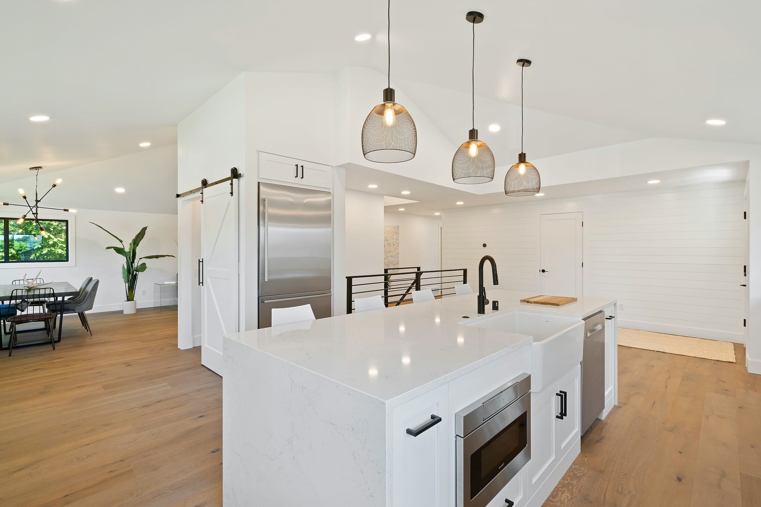 Open-plan kitchen reconfigured as part of a living-area extension.